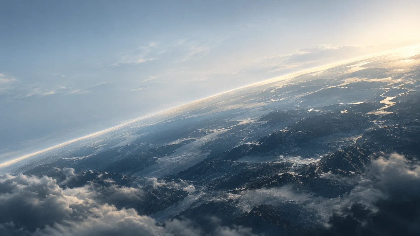 The curve of Earth at sunrise above clouds and mountains